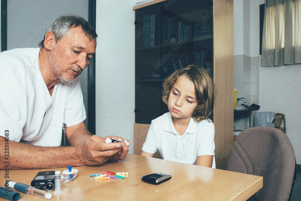 Doctor shows to make a sugar test to a diabetic child Doctor shows to make a sugar test to a diabetic child