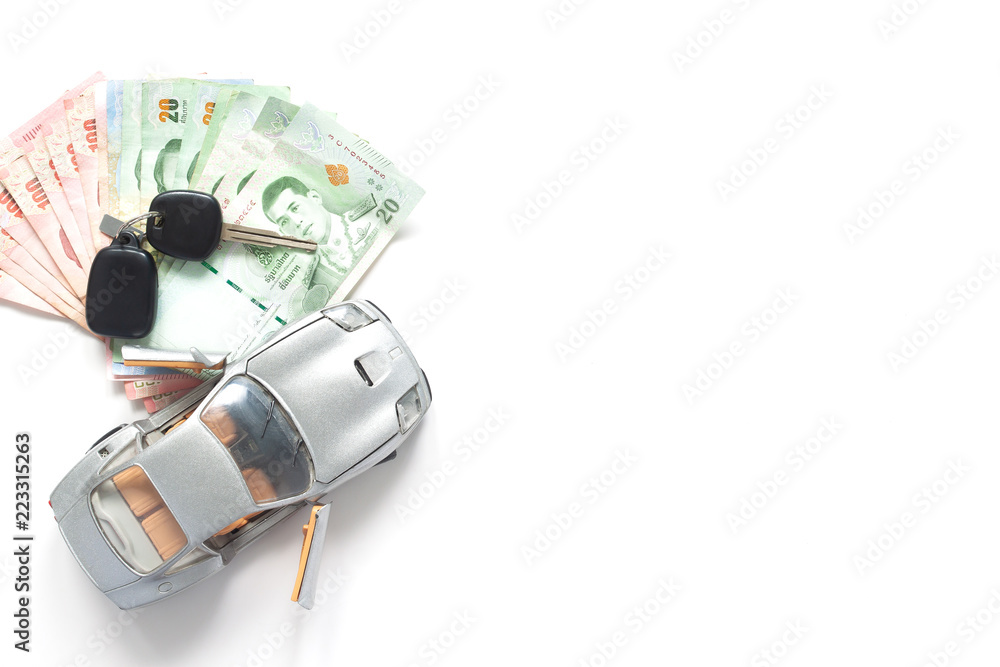 Car model and Thailand currency on white background. Car loan concept