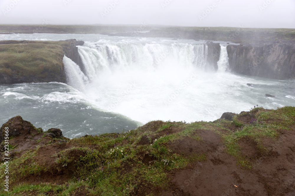 The famous Godafoss waterfall on a cloudy day in Iceland The famous Godafoss waterfall on a cloudy day in Iceland
