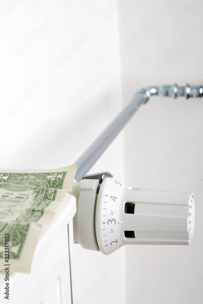 Radiator and one dollar. Money on heating battery. Heating season concept. Radiator and one dollar. Money on heating battery. Heating season concept.