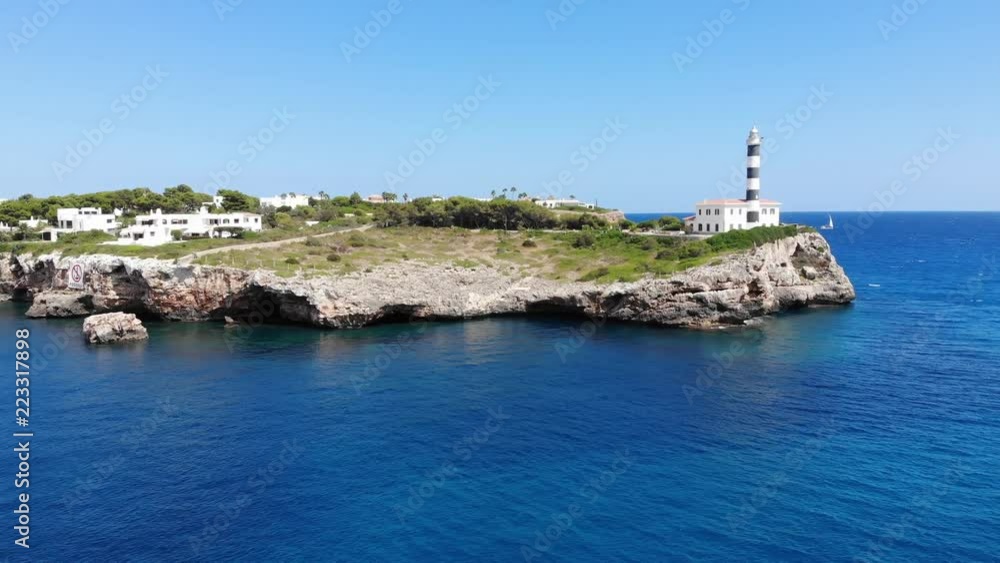 Flight over the Lighthouse, village Portocolom, Felanix region Flight over the Lighthouse, village Portocolom, Felanix region