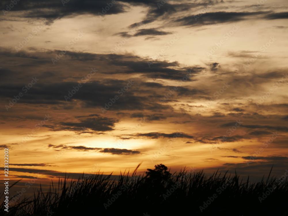 Take a photo at sunset.The sky is orange.Most of the sky is orange, but there are other colors.