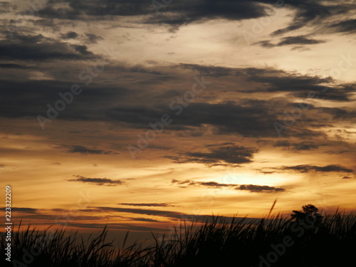 Take a photo at sunset.The sky is orange.Most of the sky is orange, but there are other colors.