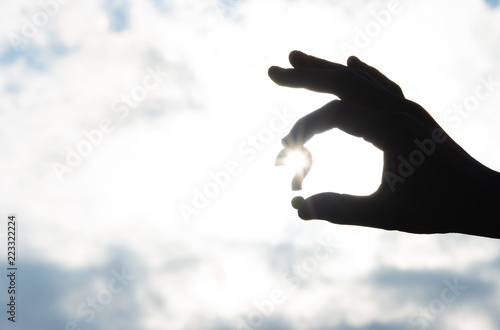 Photos Question mark object pinched by right hand