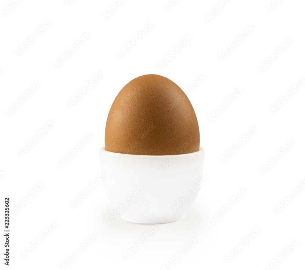 Boiled egg isolated on white background. Boiled Egg in Eggcup. Close-up of an egg isolated on white background. Single brown chicken egg isolated on white. Boiled egg isolated on white background. Boiled Egg in Eggcup. Close-up of an egg isolated on white background. Single brown chicken egg isolated on white.