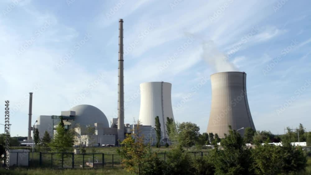 A nuclear power station. Classic shot keeping reactor and cooling towers closely composed. A nuclear power station. Classic shot keeping reactor and cooling towers closely composed.