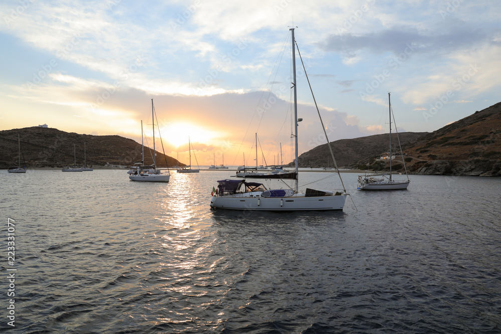 Beautiful evening and sailboats in Kolona double bay Kythnos island Cyclades Greece.