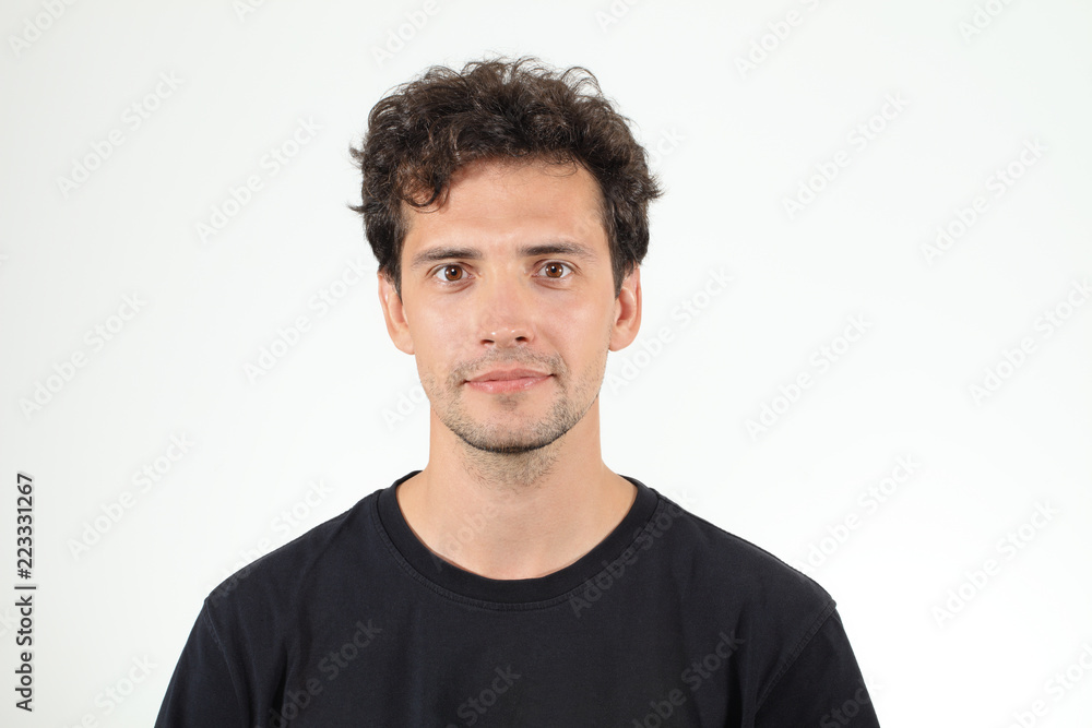 Nice young boy in black T-shirt posing to camera Nice young boy in black T-shirt posing to camera