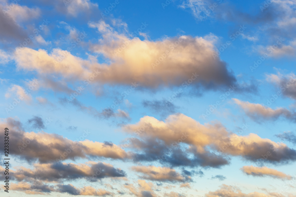 Beautiful blue sky with gold clouds as a natural background Beautiful blue sky with gold clouds as a natural background