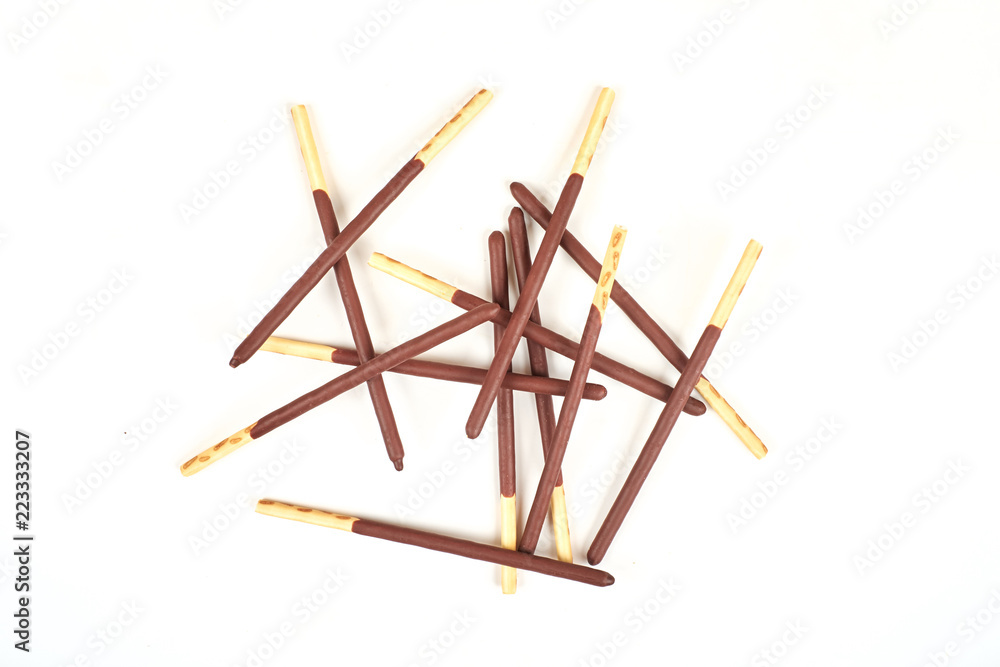 Biscuit sticks in chocolate coating on white background. Chocolate, cookies, biscuits coated bar. Biscuit sticks in chocolate coating on white background. Chocolate, cookies, biscuits coated bar.