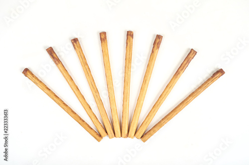 biscuit sticks with sweet filling on white background.