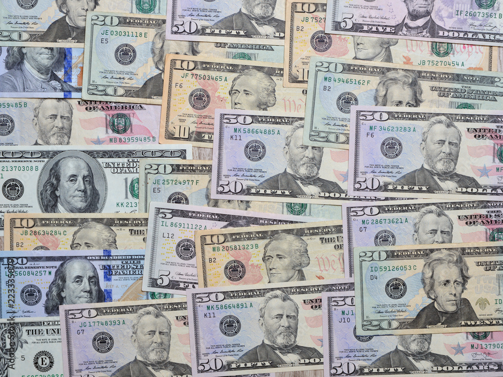 Background from different banknotes of dollars