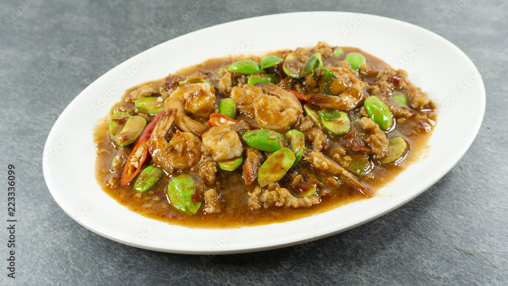 Thai food. Stir Fried Sator beans with Shrimp on stone background. Top view, Copy space for design. . Thai food. Stir Fried Sator beans with Shrimp on stone background. Top view, Copy space for design. .
