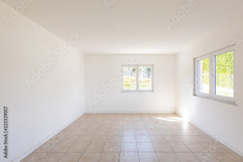 White empty room with tiles and windows © alexandre zveiger