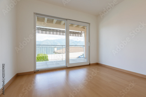 White empty room with parquet and windows © alexandre zveiger