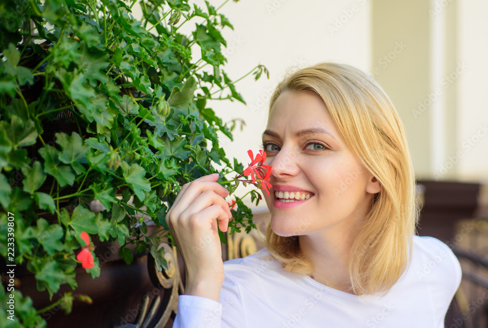 Girl sit cafe sniff flowers aroma. Beautiful terrace attract clients. Plants as natural decoration. Woman sit cafe terrace enjoy flower fragrance. Woman wait date. Enjoy every moment of your life Girl sit cafe sniff flowers aroma. Beautiful terrace attract clients. Plants as natural decoration. Woman sit cafe terrace enjoy flower fragrance. Woman wait date. Enjoy every moment of your life