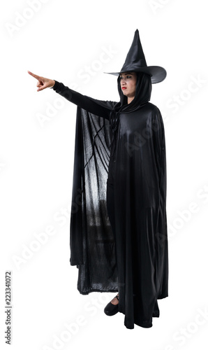 Portrait of woman in black Scary witch halloween costume standing with hat isolated on white background