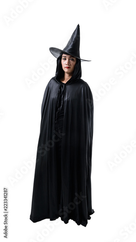 Portrait of woman in black Scary witch halloween costume standing with hat isolated on white background