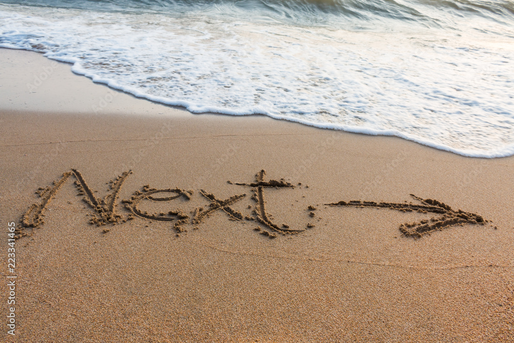 Alphabet handwritten in sand on beach Alphabet handwritten in sand on beach