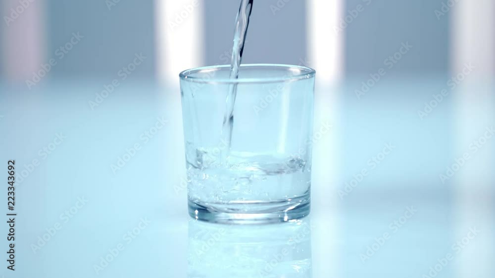Pouring water into glass. Close up of pouring liquid in clean glass. Laboratory testing of water. Clean water in glass. Healthy aqua. Freshness beverage Pouring water into glass. Close up of pouring liquid in clean glass. Laboratory testing of water. Clean water in glass. Healthy aqua. Freshness beverage
