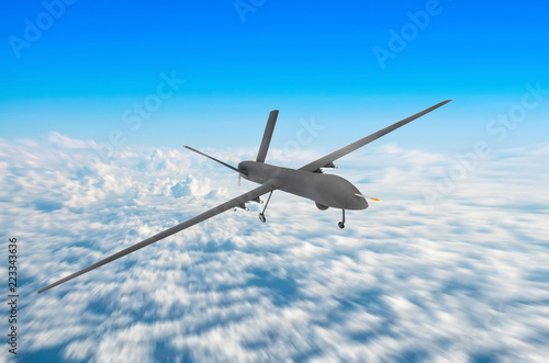 Unmanned military drone on patrol air territory at high altitude.