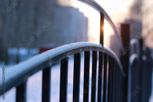 winter landscape iron fence at sunset