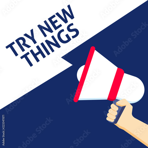 Hand Holding Megaphone With TRY NEW THINGS Announcement