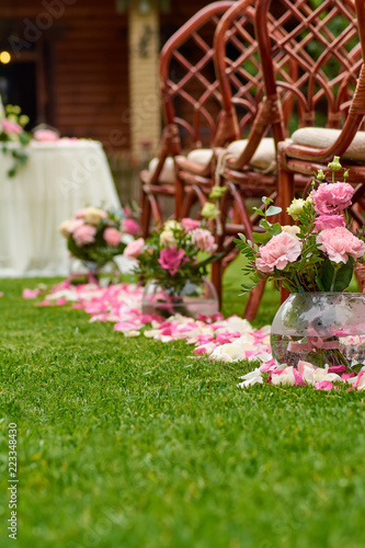 wedding bouquet and rose petals outdoors