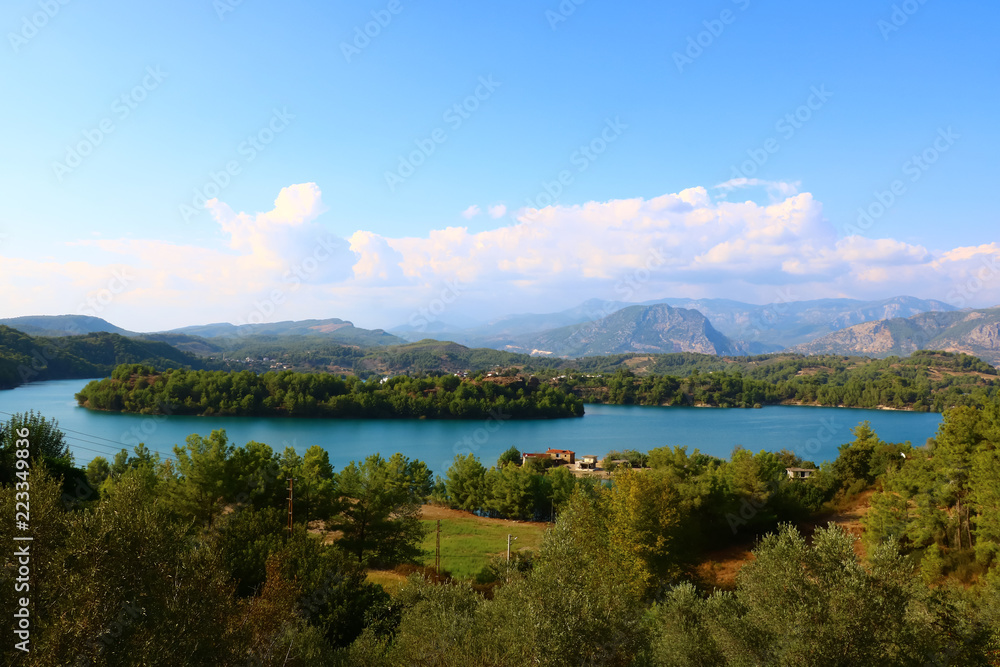 landscape with a lake in the mountains on a sunny day