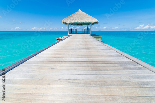 Water villas on the perfect tropical island. Beautiful blue water blue sky with inspirational mood, Maldives islands