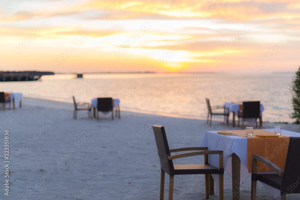 Dinner on the beach on sunset time Dinner on the beach on sunset time