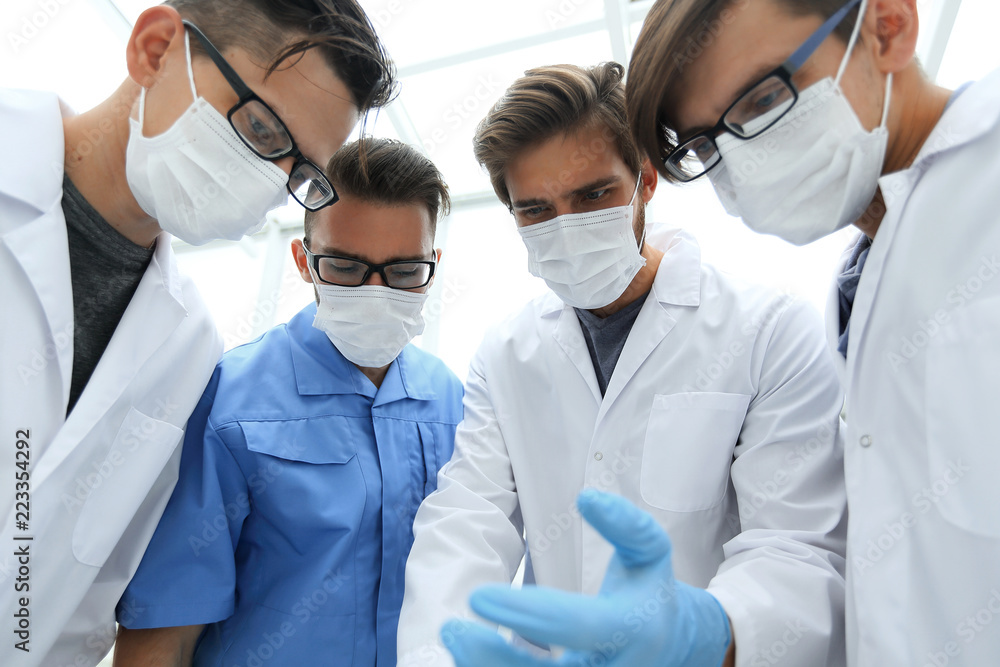 closeup. a group of doctors in the operating room closeup. a group of doctors in the operating room
