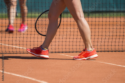 Legs of female tennis player.Close up image.