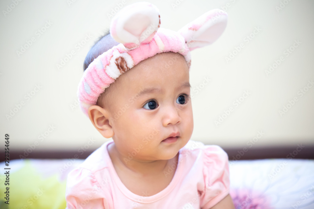 Close-Up Portrait Of Cute Baby Boy Lying On Bed, Asian baby in the room Close-Up Portrait Of Cute Baby Boy Lying On Bed, Asian baby in the room