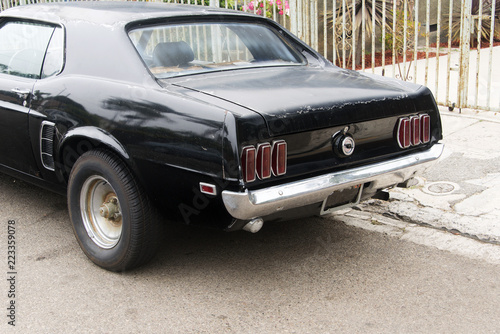 A view of a classic vintage American muscle car in the street © CoolimagesCo