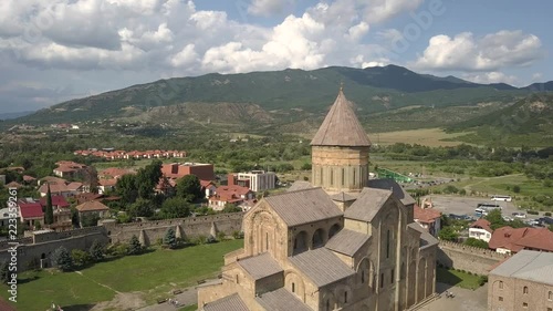 Wallpaper Mural Aerial view to famous Svetitskhoveli Orthodox Cathedral and historical and touristic town Mtskheta, near Tbilisi, Georgia. On background mountains and river Aragvi Torontodigital.ca
