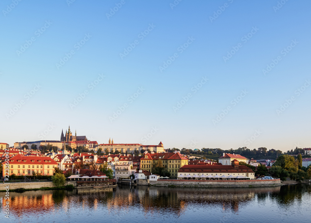 View over Vltava River towards Lesser Town and Castle at sunrise, Prague, Bohemia Region, Czech Republic