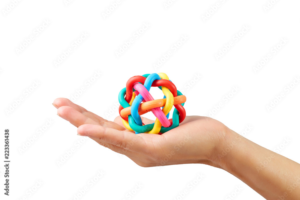 Crop hand holds color toy isolated on white background. Business concept of connection different department into one Crop hand holds color toy isolated on white background. Business concept of connection different department into one