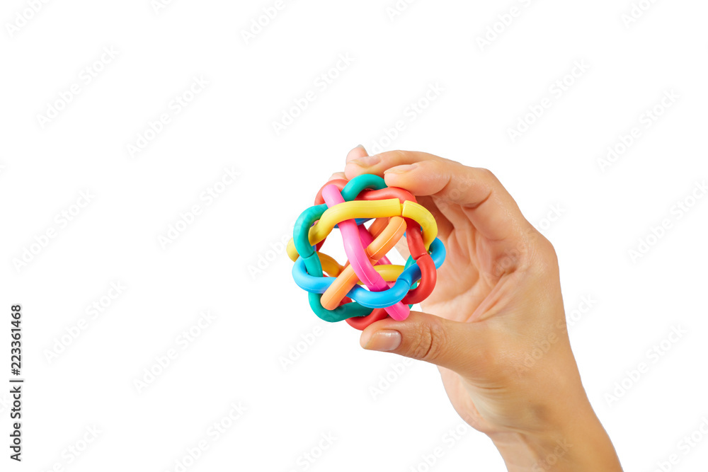 Crop hand holds color toy isolated on white background. Business concept of connection different department into one Crop hand holds color toy isolated on white background. Business concept of connection different department into one