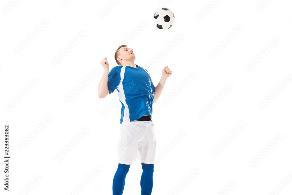 athletic young soccer player hitting ball with chest isolated on white athletic young soccer player hitting ball with chest isolated on white