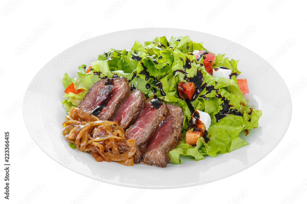 Salad with roast beef with marinated onions and balsamic vinegar, sauce on plate, white isolated background Side view. For the menu, restaurant, bar, cafe