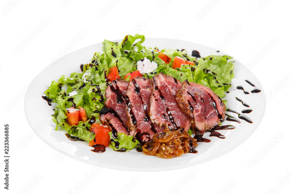 Salad with roast beef with marinated onions and balsamic vinegar, sauce on plate, white isolated background Side view. For the menu, restaurant, bar, cafe