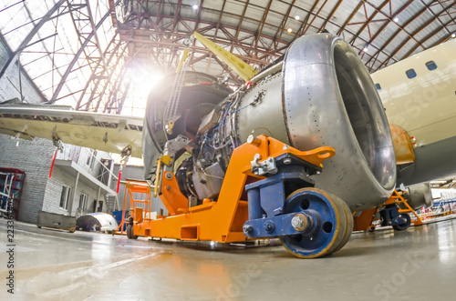 The engine of the aircraft is repaired, removed from the wing and installed on a technical cart.