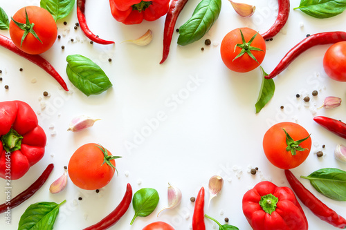 Colorful pizza ingredients pattern made of tomatoes, pepper, chili, garlic and  basil on white background. Cooking concept. Top view. Flat lay. Copy space © thayra83