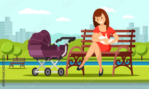 Young european woman sitting on a bench is breastfeeding her little child close near violet baby carriage at public place in a park