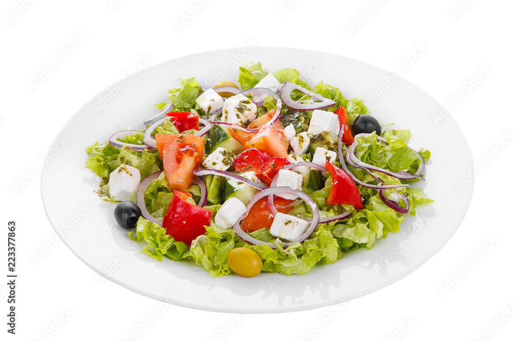 Greek salad with feta, olives, lettuce, red onion, cucumber, tomato, bell pepper, oil on plate, white isolated background Side view. For the menu, restaurant bar cafe