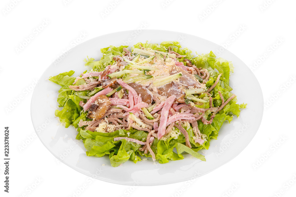 Salad with mushrooms, champignons, ham, cucumber, cheese, lettuce, mayonnaise on plate, white isolated background Side view. For the menu restaurant bar cafe Salad with mushrooms, champignons, ham, cucumber, cheese, lettuce, mayonnaise on plate, white isolated background Side view. For the menu restaurant bar cafe
