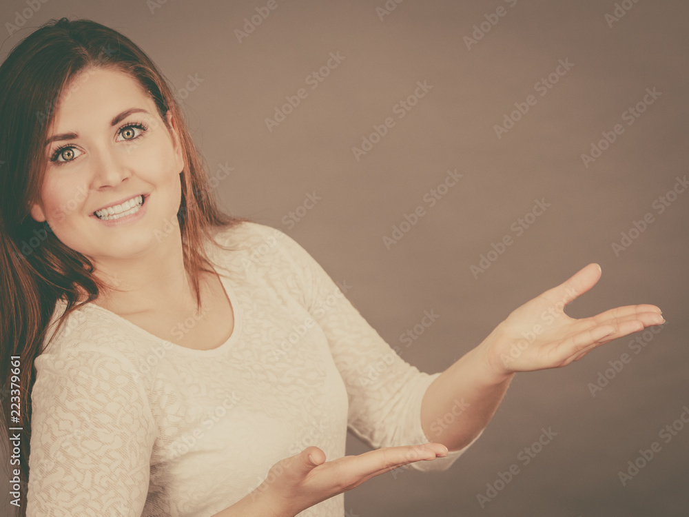 Happy woman presenting copyspace with hands Happy woman presenting copyspace with hands
