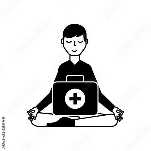 man sitting in meditation with kit first aid