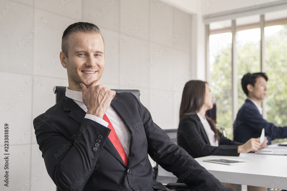 Business man meeting in office and look to camera. Business man meeting in office and look to camera.